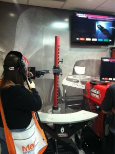 Arc-Zone's Joanie Butler virtual welding on the Lincoln Electric VRTEX at FABTECH 2012