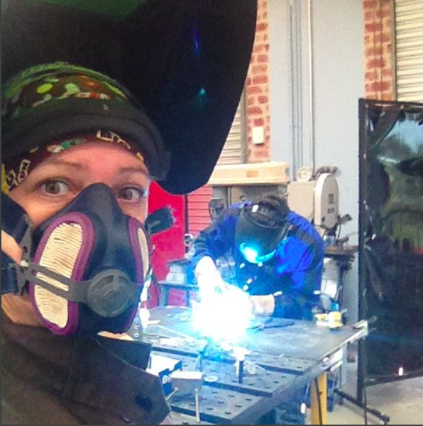 Joanie Butler welding scrap metal into art at Arc-Zone.com